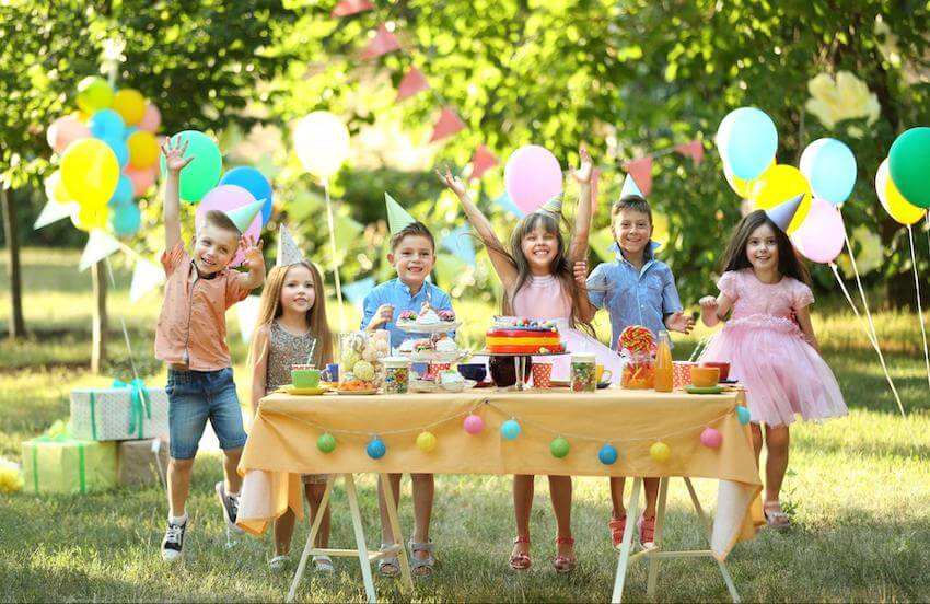 Kids celebrating at an outdoor birthday party