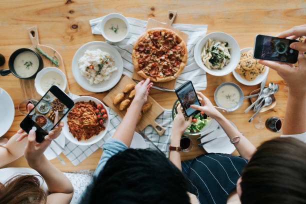 Guests photographing food and drinks